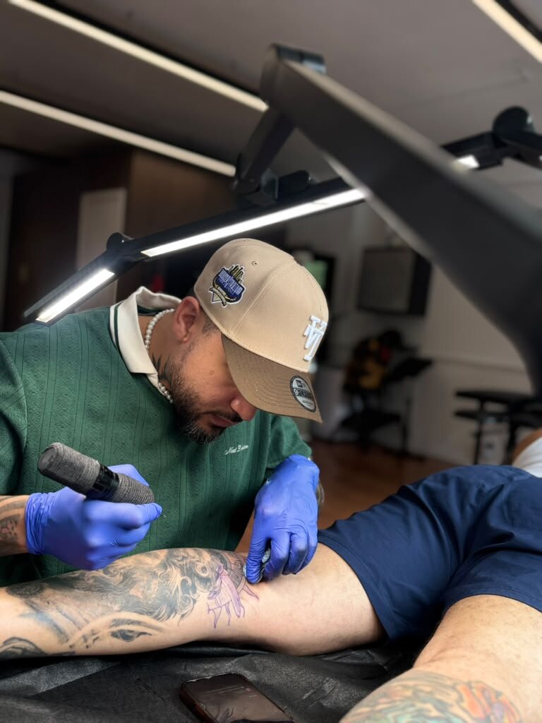 Artist tattooing